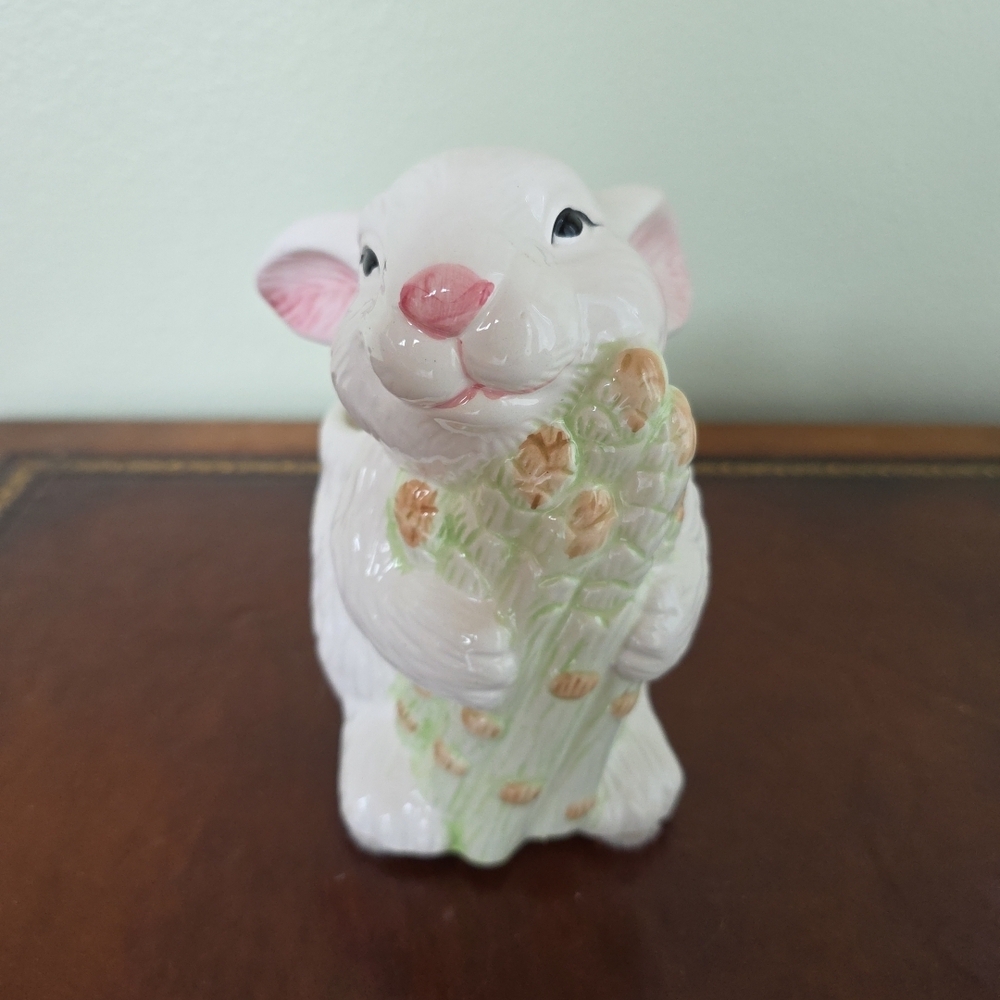 A Bloom-Rite ceramic Easter bunny planter holding asparagus